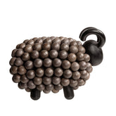 Pässi-veistos, musta ja puu