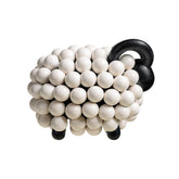 Pikkupässi-veistos, valkoinen/ musta